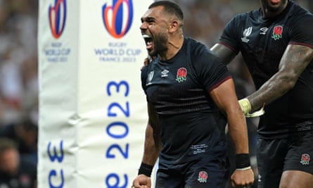 England’s Joe Marchant celebrates after scoring a try against Japan
