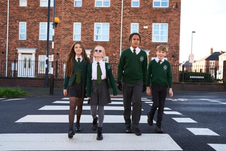 Children cross a zebra crossing in North Shields