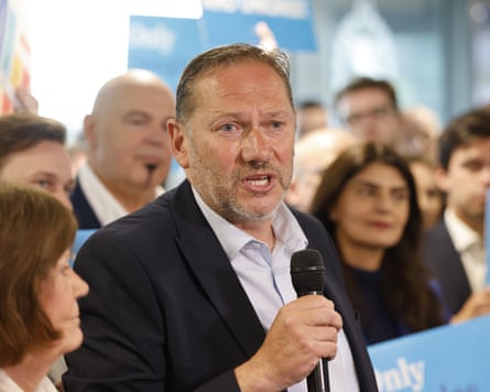 Douglas Lumsden speaks at a Tory campaign event with supporters around him
