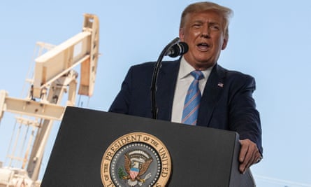 Donald Trump at a lectern in front of a pumpjack.