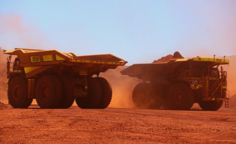 Autonomous haul trucks transport iron ore from the Kings mine site at Fortescue Metals Group Ltd.'s Solomon mining hub in the Pilbara