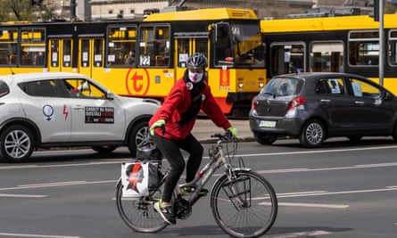 A woman rides her bicycle during a protest of Polish women’s rights activists in Warsaw.