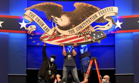 Workers adjust signage as preparations take place for the first Presidential debate in the Sheila and Eric Samson Pavilion, Monday, Sept. 28, 2020, in Cleveland. The first debate between President Donald Trump and Democratic presidential candidate, former Vice President Joe Biden is scheduled to take place Tuesday, Sept. 29. (AP Photo/Patrick Semansky) Workers adjust signage as preparations take place for the first Presidential debate in the Sheila and Eric Samson Pavilion, Monday, Sept. 28, 2020, in Cleveland. The first debate between President Donald Trump and Democratic presidential candidate, former Vice President Joe Biden is scheduled to take place Tuesday, Sept. 29. (AP Photo/Patrick Semansky)