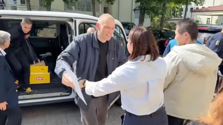 Syarhei Tsikhanouski embracing a woman