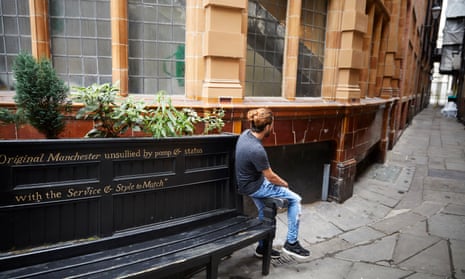 former asylum seeker on a bench in Manchester