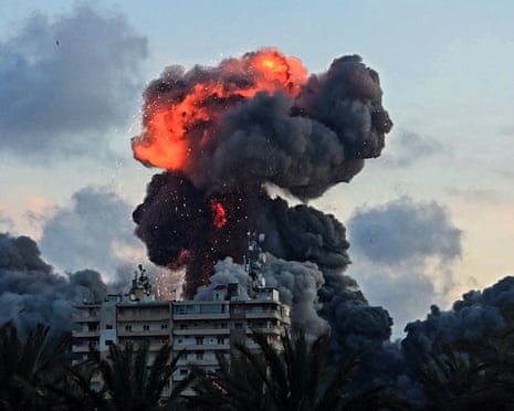 A fireball and smoke erupt from a building after an Israeli strike in Tyre, southern Lebanon, on Thursday