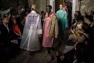 Models in macs at the Burberry show in Clerkenwell.