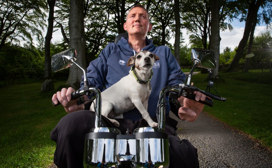 Doddie Weir with pet terrier Mavis. The 61-cap Scotland international now needs help from his wife, Kathy, to get on to his mobility scooter.
