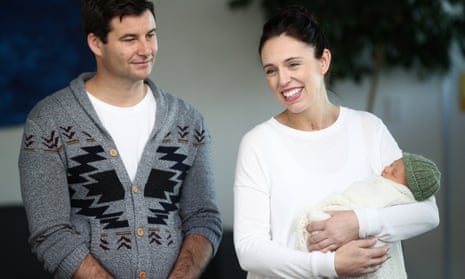 Jacinda Ardern with her partner and baby