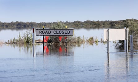 Water and a ‘Road closed’ sign