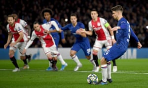 Jorginho rolls the ball into the net.