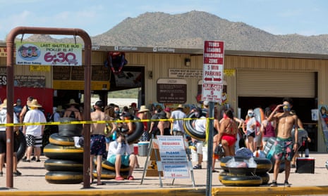 People prepare to go tubing on Salt River in Arizona. About half of Arizona’s almost 80,000 cases fall into the 20-44-year-old age bracket.