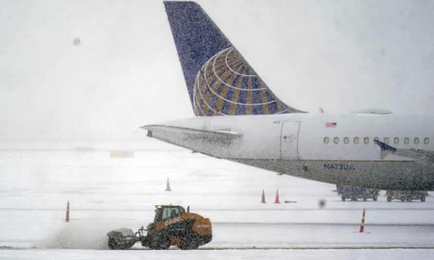 Snow and ice are cleared at Dallas Fort Worth International Airport in Grapevine, Texas.