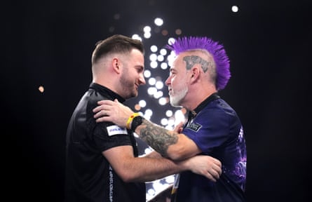 Arno Merk (left) and Peter Wright after their second-round match of the PDC world championship at the Alexandra Palace.