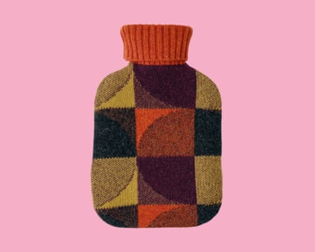 Patterned hot-water bottle cover on a pink background