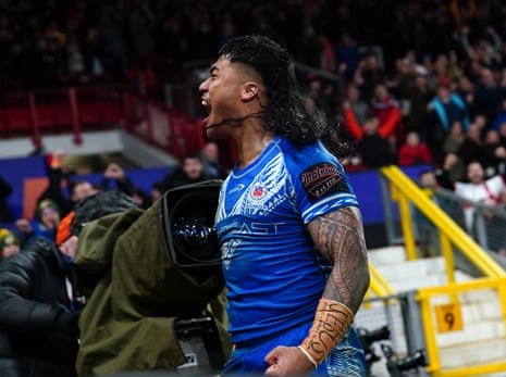 Samoa's Brian To'o celebrates scoring his team's first try of the match.