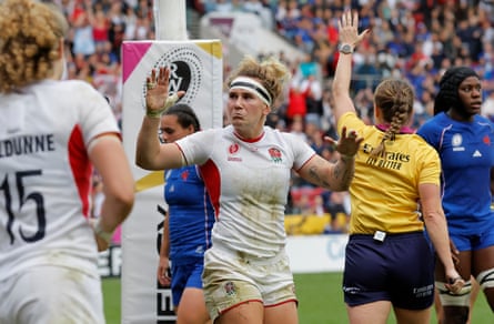 Meg Jones, the England centre, reacts after scoring a try.