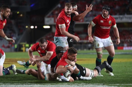 Rhys Webb of the Lions barges past Scott Barrett of the All Blacks to score his team’s second try.