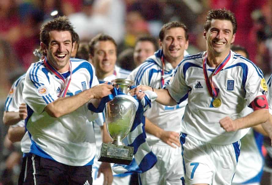 Georgios Karagounis, left, and Theodoros Zagorakis celebrate with the trophy after Greece stunned Europe in 2004