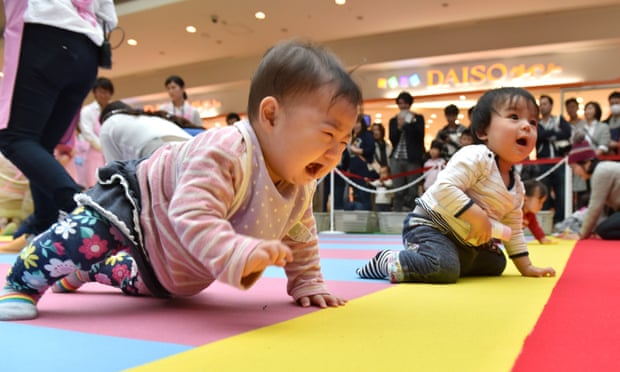 babies compete in a baby crawling competition in Yokohama, Japan.
