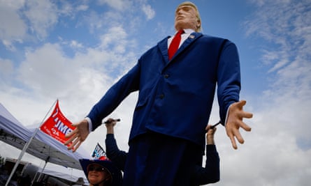A giant Donald Trump loomed over supporters at the rally, which was co-sponsored by the Republican Party of Florida.