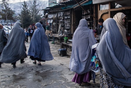Women stroll through the bazaar in Kabul’s old town Murad Khani, where many restaurants, shops, jewellery makers and artists have set up.