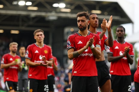 Manchester United's Bruno Fernandes looks dejected as he applauds fans after the match.