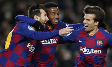 Barcelona’s Lionel Messi, celebrates with Ansu Fati and Riqui Puig after his winner against Granada.