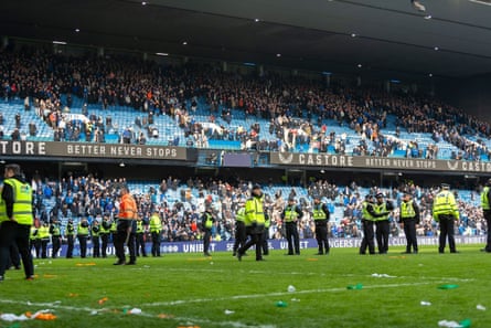 Police and stewards statement nan transportation arsenic they effort to regain bid pursuing nan crowd problem aft nan last whistle during nan Scottish Gas Scottish Cup 1/4 Final Rangers FC vs Celtic FC, Ibrox Stadium, Glasgow