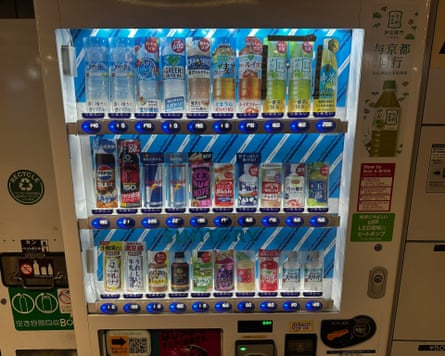 A drinks machine in Japan with bottles of water and Nope among the selection.