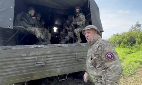 Yevgeny Prigozhin with Wagner mercenaries on 1 June.