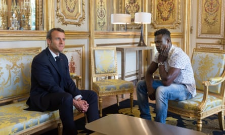 French president Emmanuel Macron meets Mamoudou Gassama at Elysee Palace. Gassama received citizenship after rescuing a toddler hanging from a building.