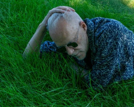 Nirosta Steel lies on the grass at his home in Champaign, Illinois