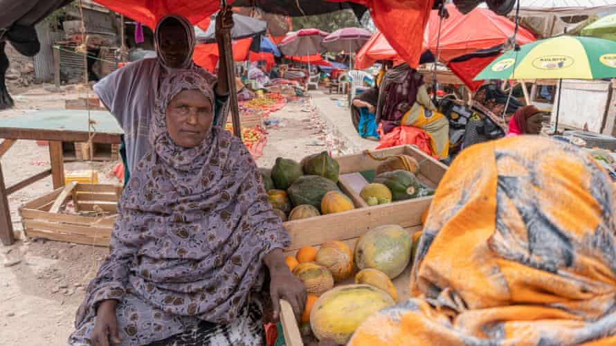 Khadra Mohamed Dahir sits selling fruit in Waheen