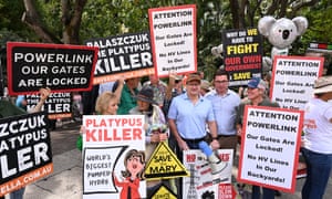 Federal leader of the Nationals David Littleproud with protesters during a press conference at Parliament House in Brisbane