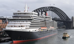 enormous cruise ship in sydney harbour with the bridge behind it