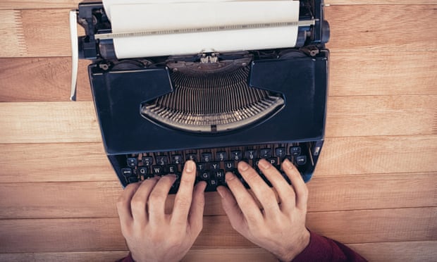 Hands using typewriter