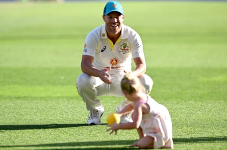 Warner plays with his daughter after the first Test in Brisbane.