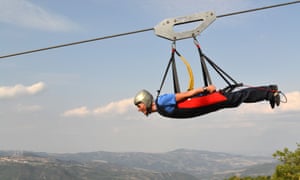 Riding the zip wire between Castelmezzano and Pietrapertosa.