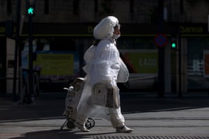 A woman wears plastic film outside in Granada. Spain