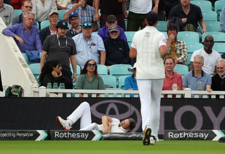 Chris Woakes lands heavily on his shoulder after chasing a ball at the boundary.
