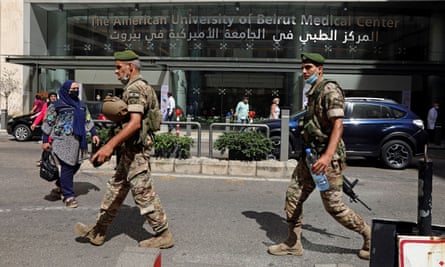 Lebanese soldiers outside the American University of Beirut Medical Centre, which let go hundreds of employees. Lebanese soldiers outside the American University of Beirut Medical Centre, which let go hundreds of employees.