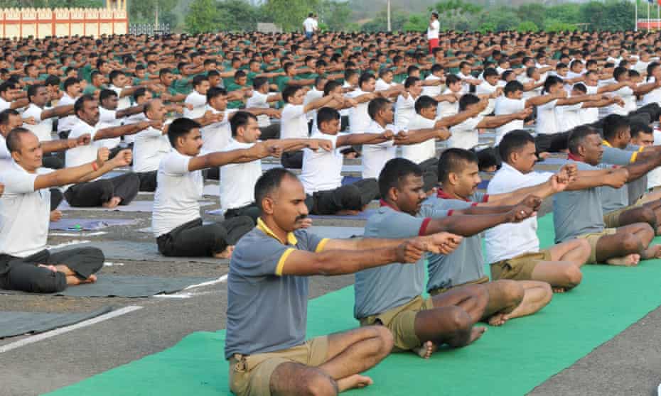 Indian army personnel practising yoga