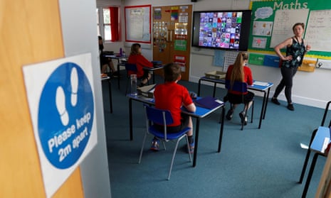 Children in an adapted classroom at Watlington primary school in Oxfordshire as some schools in England re-open as lockdown measures are eased.
