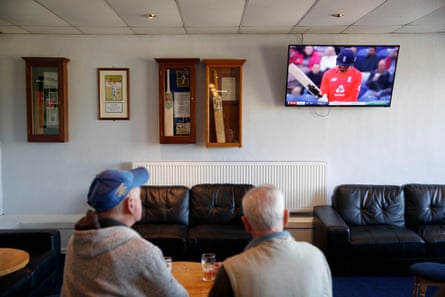 Two drinkers in the clubhouse watch an England T20 match against Pakistan while Lowerhouse take on Norden.