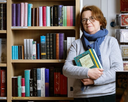 Aude Pasquier holding a Bible.