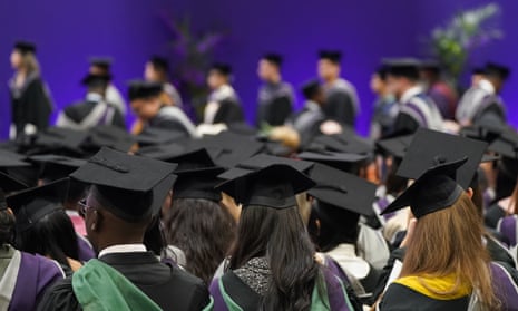 Graduate students with black hats viewed from behind