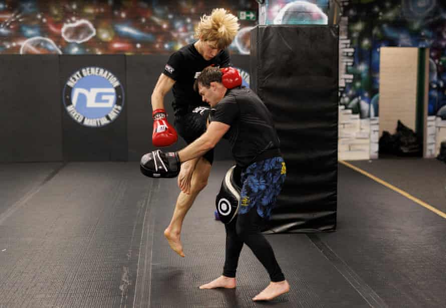 Paddy Pimblett knee-kicks to the head of his coach, Ellis Hampson.