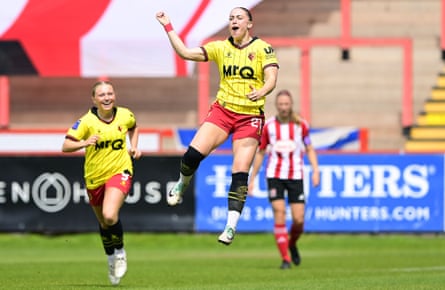 Flo Fyfe jumps in the air as she celebrates a goal