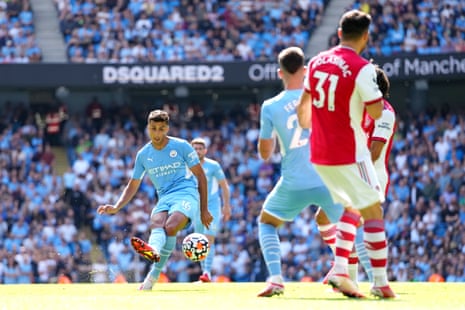 Rodrigo (centre) curls home Manchester City’s fourth goal.